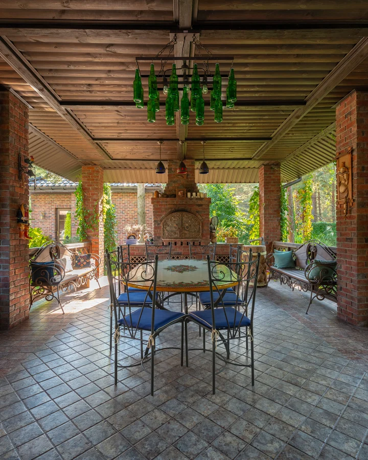 Stamped concrete patio in a stone pattern under a covered outdoor dining area
